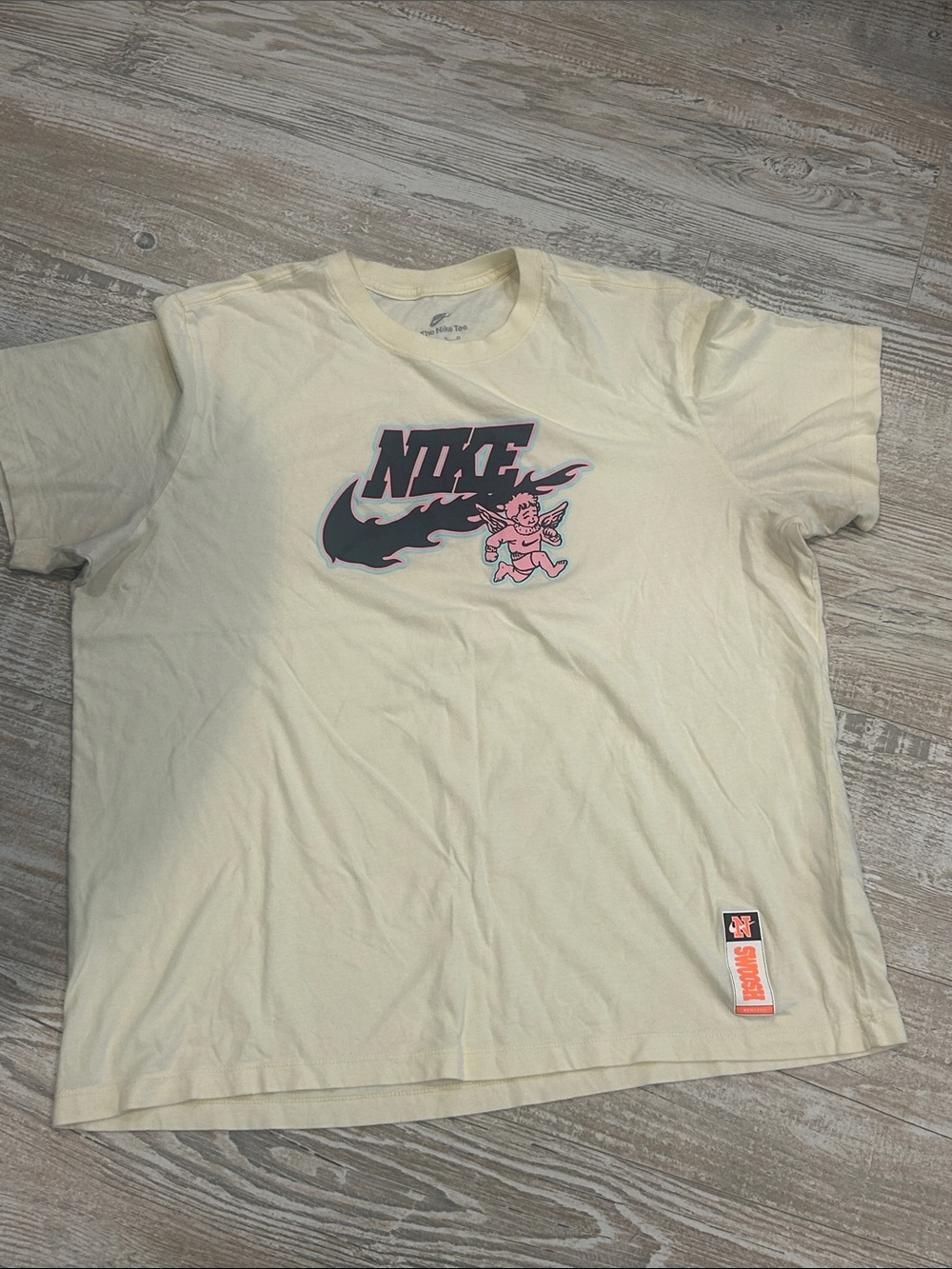 Nike Men’s Cream Tee with Black and Pink Graphic